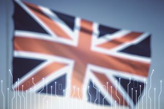 A Union Jack flag with circuits in front of it