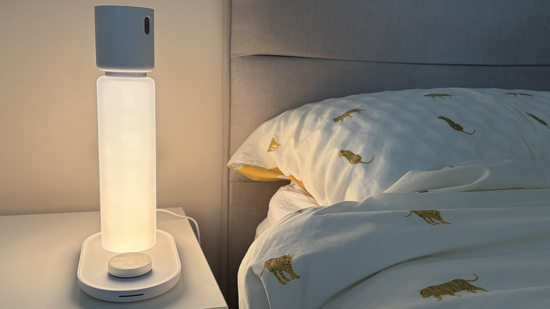 The Sleepal AI Lamp in our reviewer's bedroom, with the lamp lit.