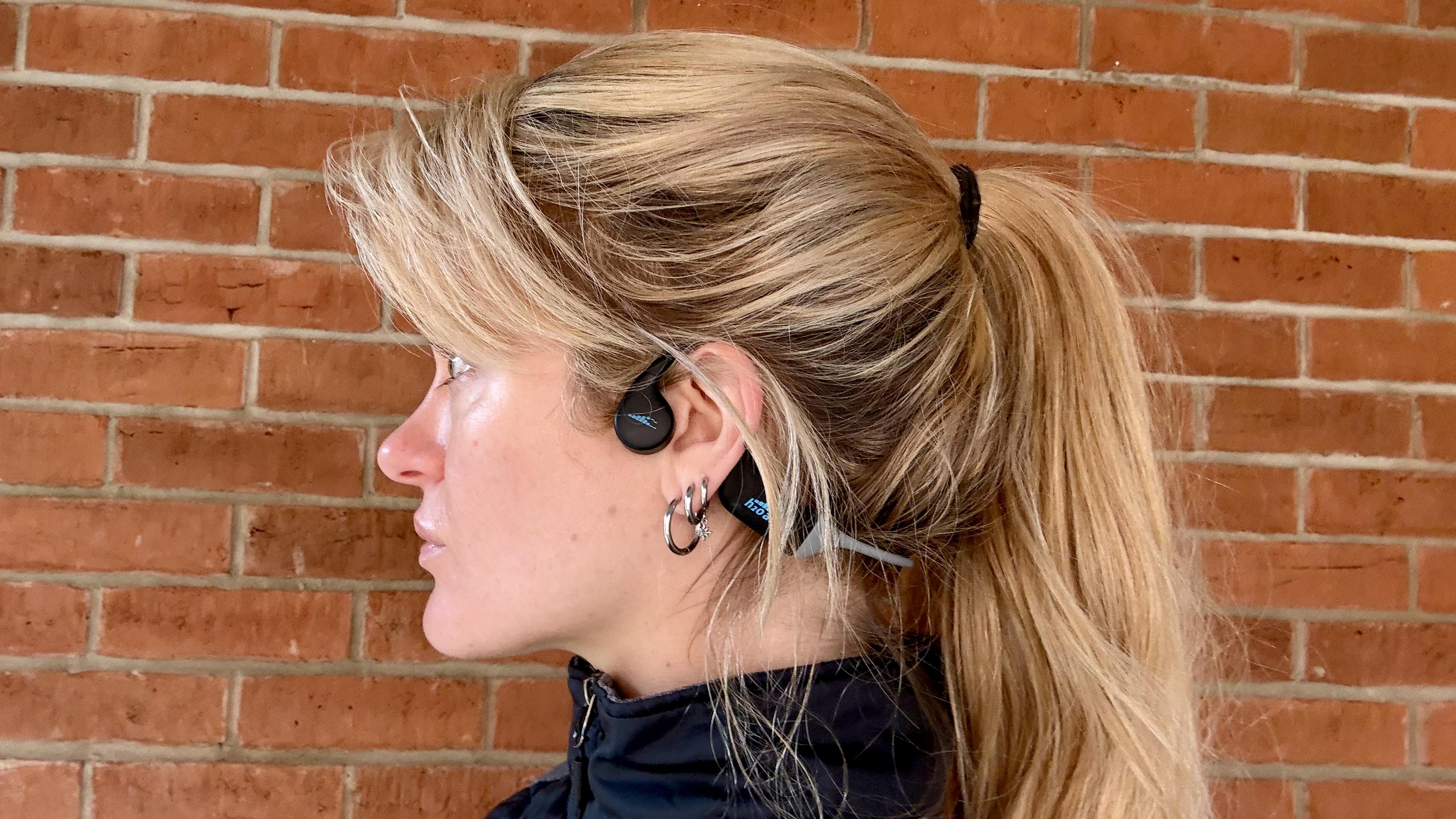 Becca Caddy wearing the h2o audio tri run bone conduction headphones