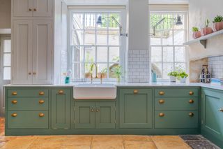 green shaker kitchen with white higher cabinets sustainable kitchens