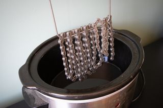 A chain being waxed