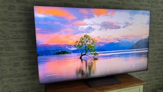 The 65-inch TCL C7K Mini LED TV photographed in a living room