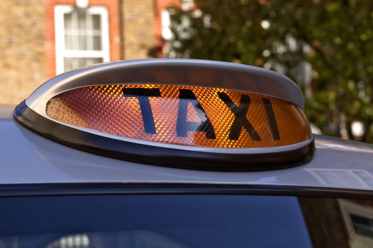 Black taxi cab sign