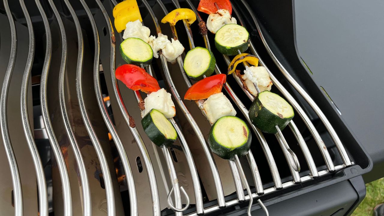 A close up of testing vegetable skewers on the Napoleon Phantom Rogue SE 425 RSIB