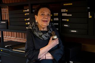 Mexican photographer Graciela Iturbide poses for a picture at her studio designed by Mexican architect Mauricio Rocha in Mexico City, on October 22, 2021.