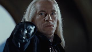 Lucius Malfoy pointing his wand at Harry in Chamber of Secrets
