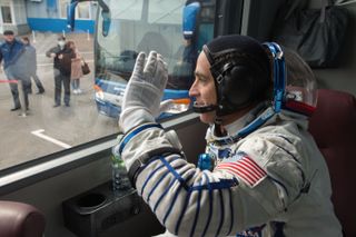 NASA astronaut Chris Cassidy waves farewell before boarding a Soyuz rocket, on April 9, 2020.