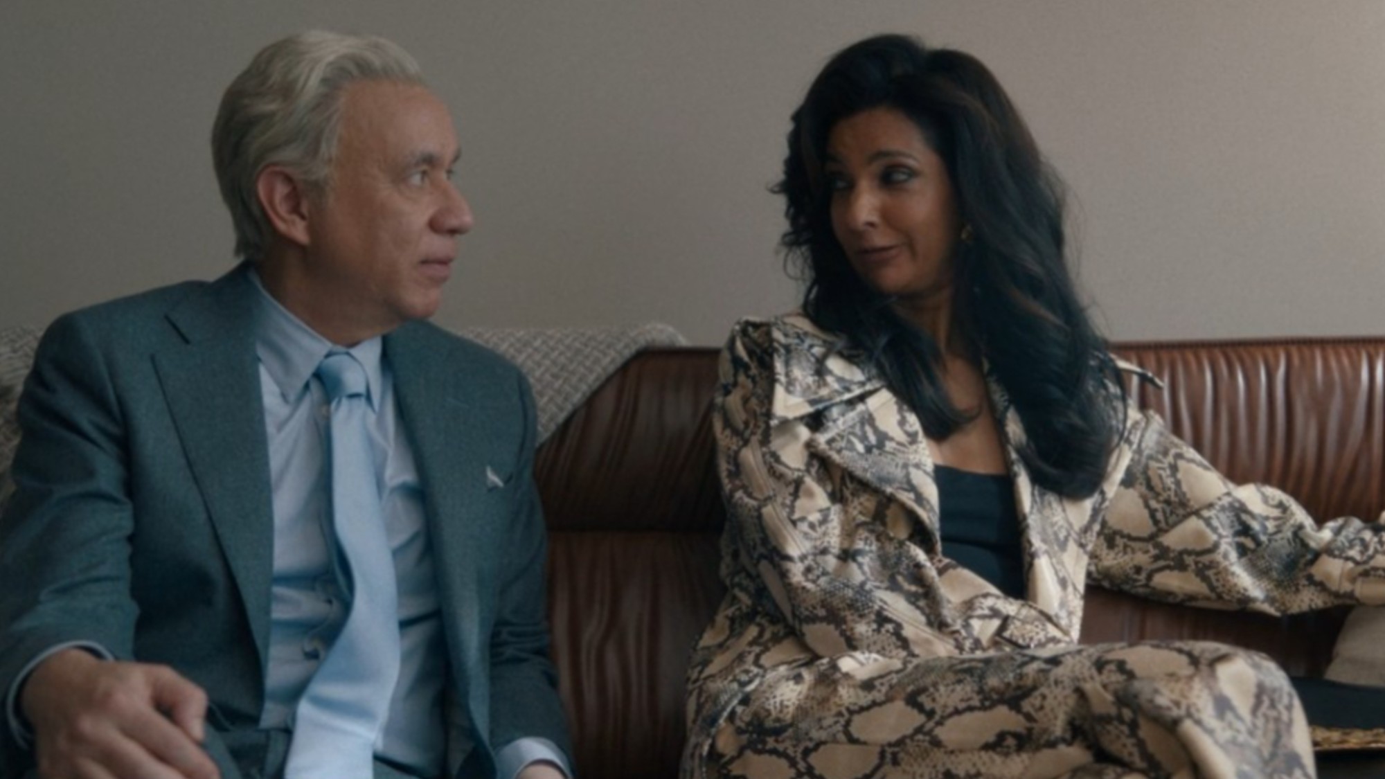 Poorna Jagannathan and Fred Armisen talking while sitting in Deli Boys.