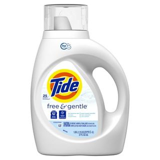 White bottle of Tide Free & Gentle Liquid Laundry Detergent, 25 Loads 37 Fl Oz with plastic see through measuring cup lid and large cut out handle