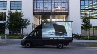 Surfshark van displaying "Your data is leaking" message in front og the new Big Tech building in Munich on Friday October 13, 2023.
