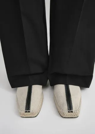 TOTEME Leather-trimmed canvas slippers.