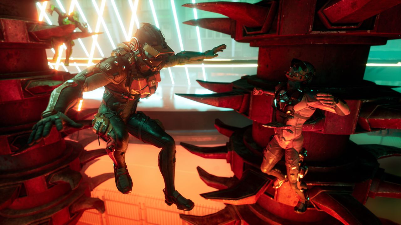 One cyborg ninja guy avoids spike trap while another falls