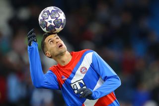 Joao Cancelo of Bayern Munich controls the ball while warming up prior to the UEFA Champions League quarterfinal first leg match between Manchester City and FC Bayern München at Etihad Stadium on April 11, 2023 in Manchester, England.