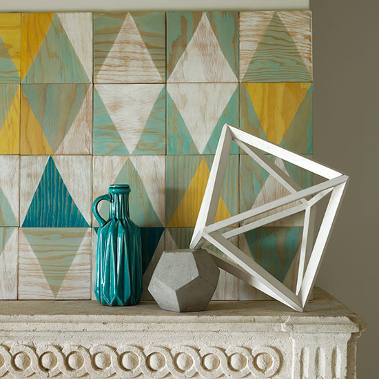 grey designed wall white showpiece and blue designed bottle