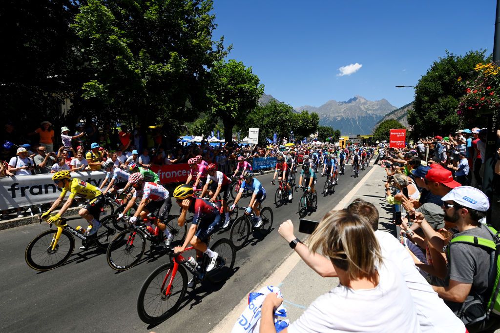 SAINTETIENNE FRANCE JULY 15 Tadej Pogacar of Slovenia and UAE Team Emirates White Best Young Rider Jersey Wout Van Aert of Belgium and Team Jumbo Visma Green Points Jersey Jonas Vingegaard Rasmussen of Denmark and Team Jumbo Visma Yellow Leader Jersey Simon Geschke of Germany and Team Cofidis Polka Dot Mountain Jersey and The Peloton prior to the 109th Tour de France 2022 Stage 13 a 1926km stage from Le Bourg dOisans to SaintEtienne 488m TDF2022 WorldTour on July 15 2022 in SaintEtienne France Photo by Tim de WaeleGetty Images