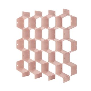 A pink honeycomb shaped drawer organizer