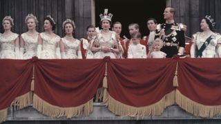 Queen Elizabeth II and the Duke of Edinburgh wave at the crowds from the balcony of Buckingham Palace
