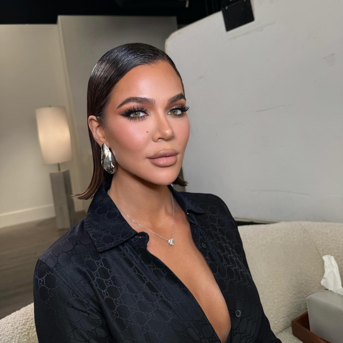 Khloe Kardashian wearing a slicked blunt bob.