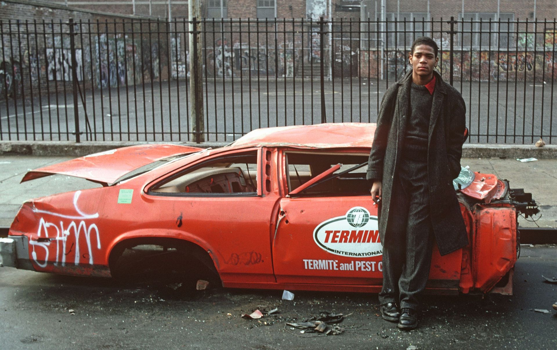 Man beside car wreck, from pages of Rapper's Deluxe