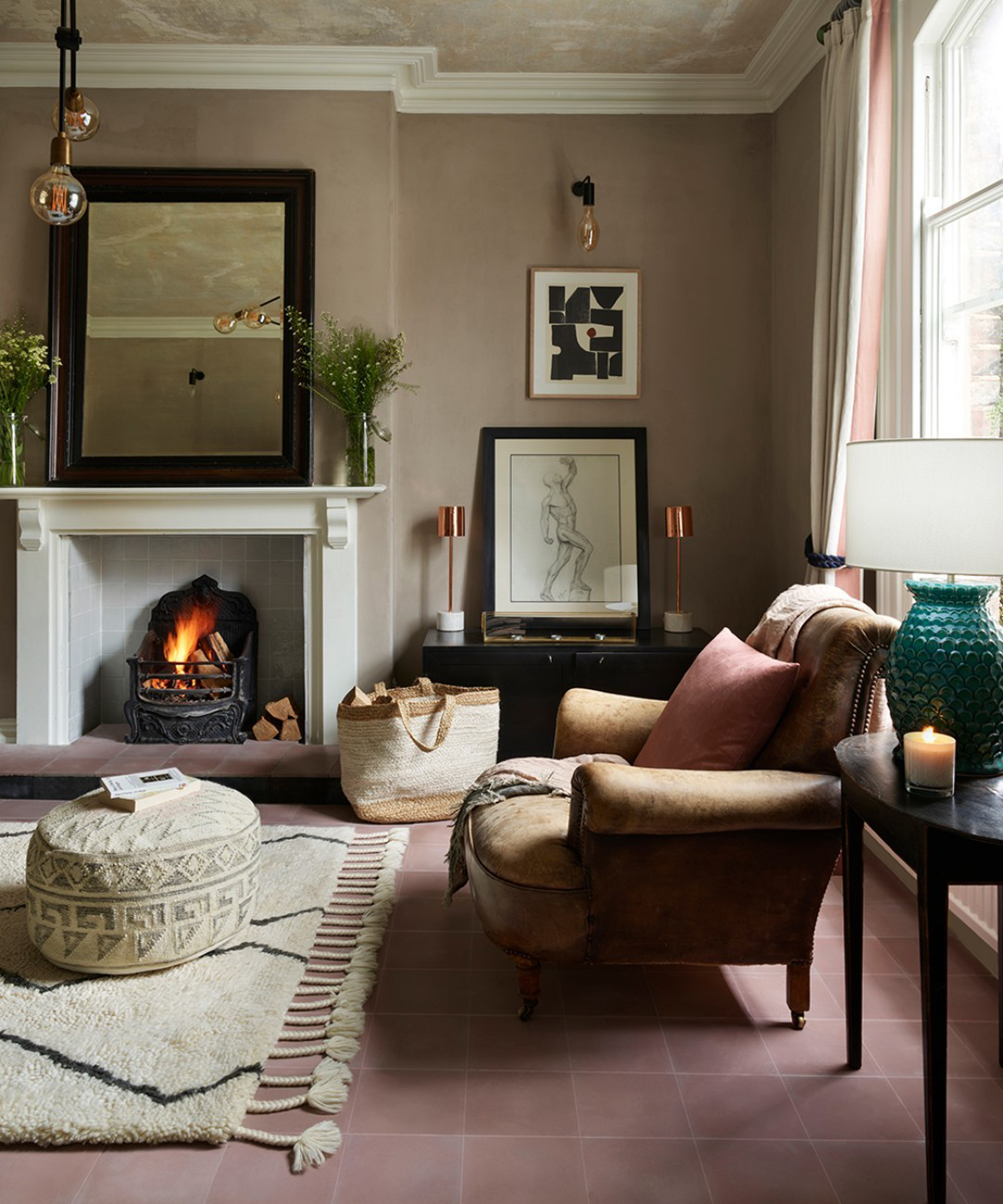 Soho House fireplace with grey inset tiles and pink tiled flooring