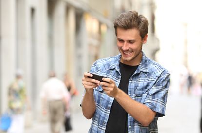 Man playing game with a smart phone