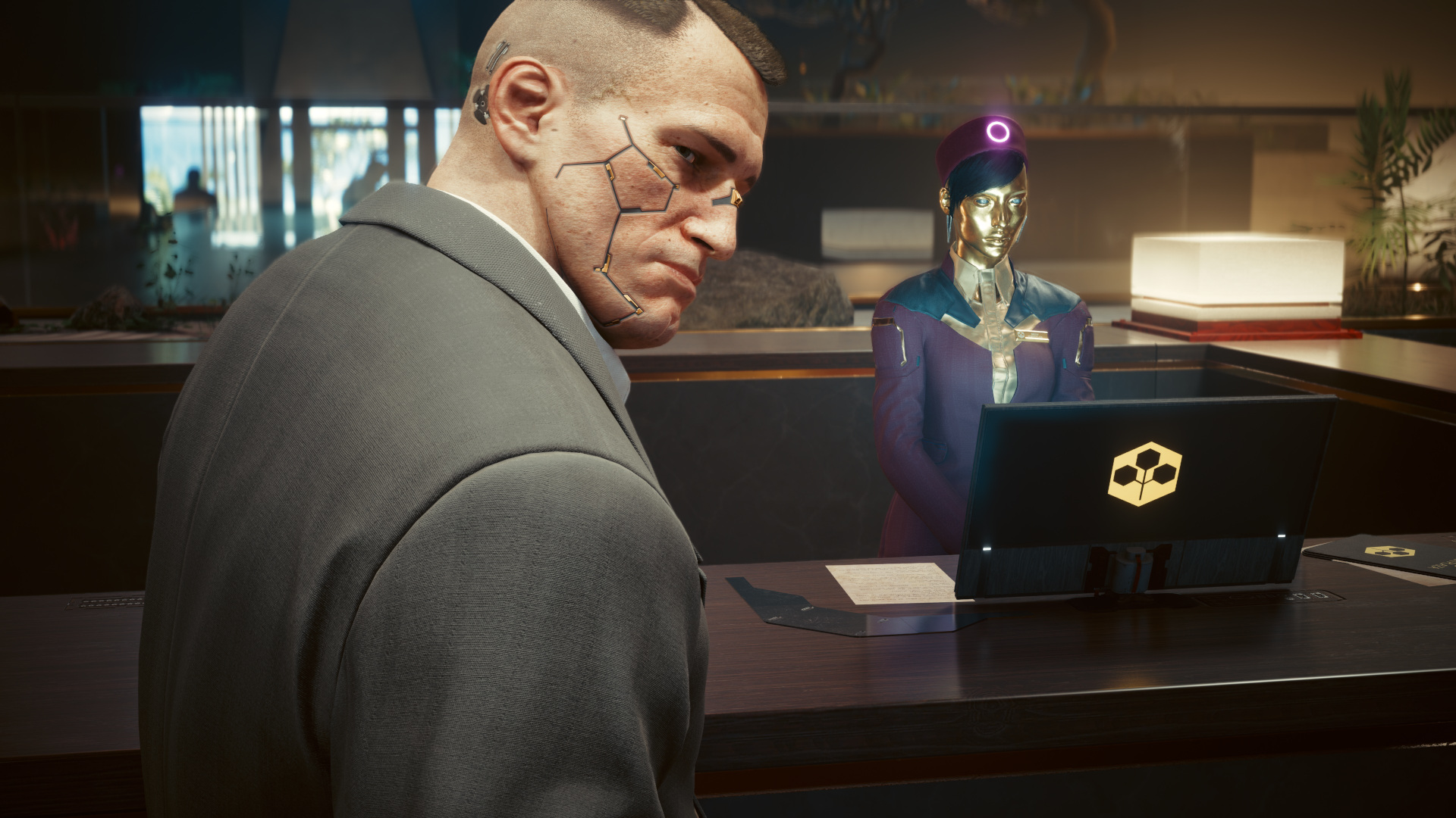 In Cyberpunk 2077, Jackie looks over his shoulder at the front desk of Konpeki Plaza