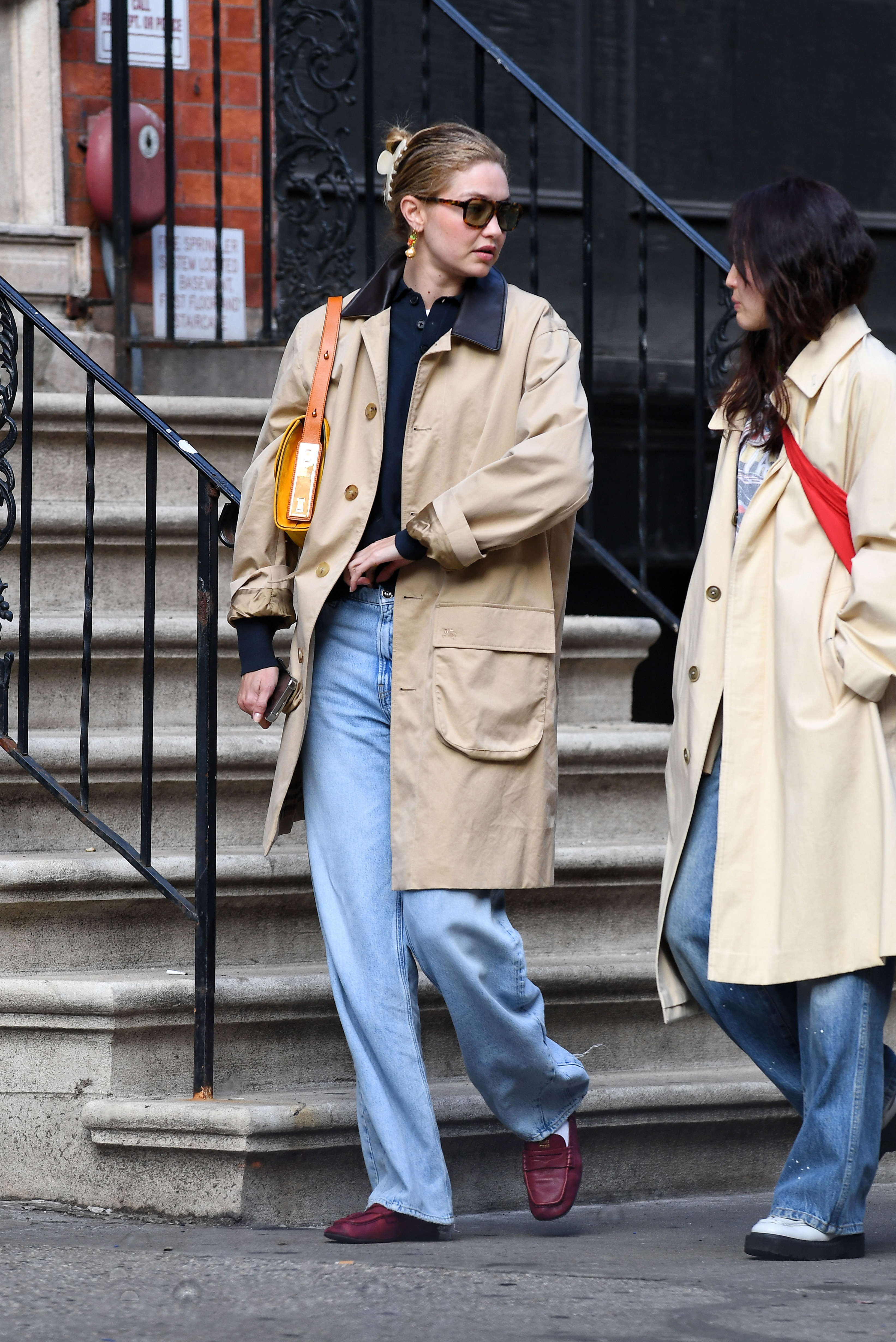 Gigi Hadid wore a New York City It-girl's uniform: a navy polo, barn jacket, jeans and the soft leather loafers trend
