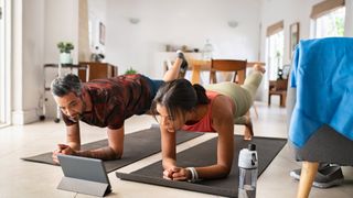 Couple doing a HIIT workout at home