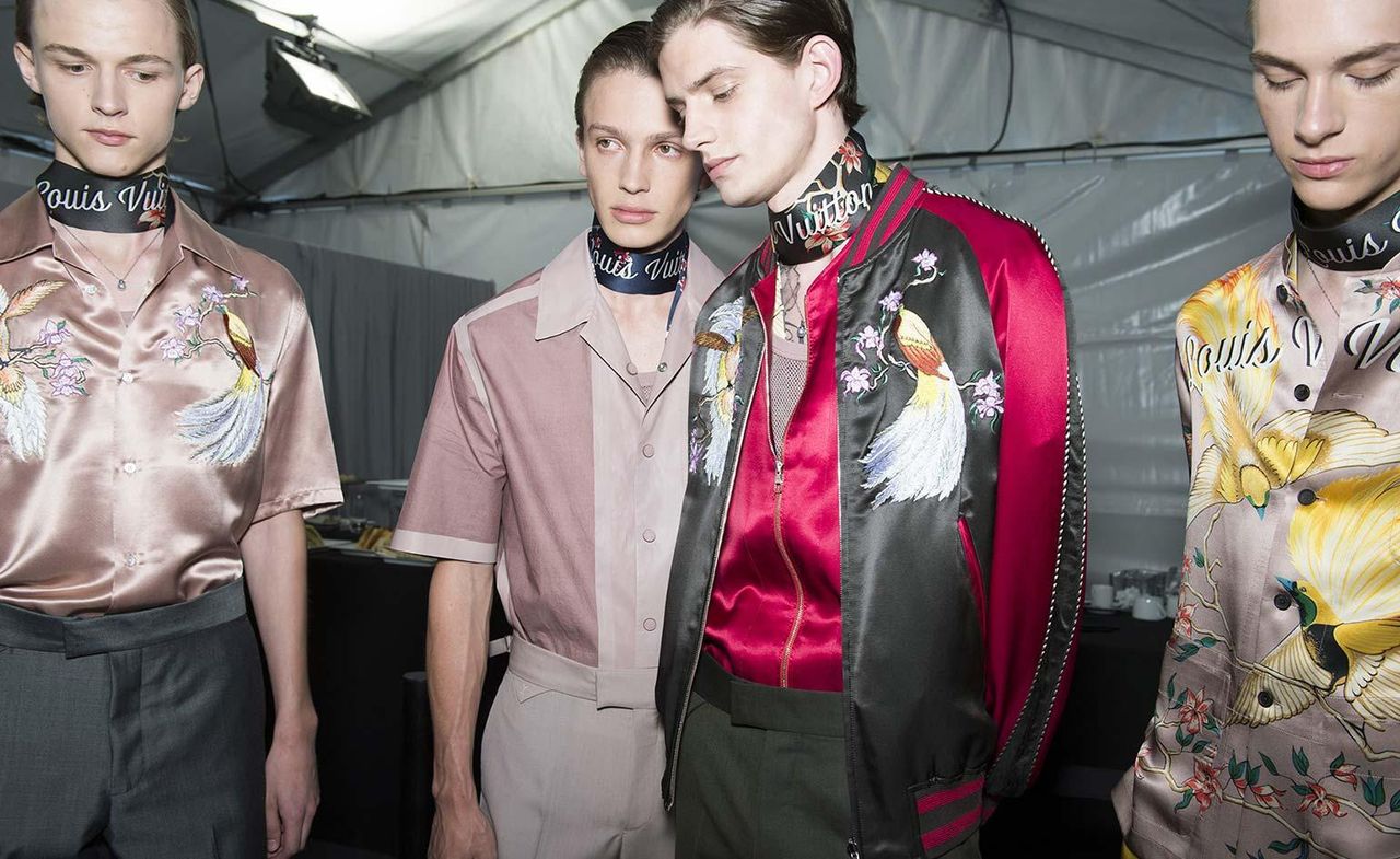 Group of male models wearing silk patterned shirts