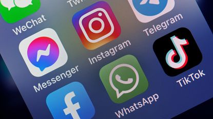 In this photo illustration, the logos of social media applications, Messenger, Instagram, Facebook, WhatsApp and TikTok is displayed on the screen of an iPhone on October 06, 2021 in Paris, France.