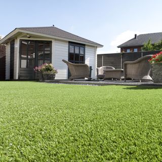 sloping roof house with grass lawn