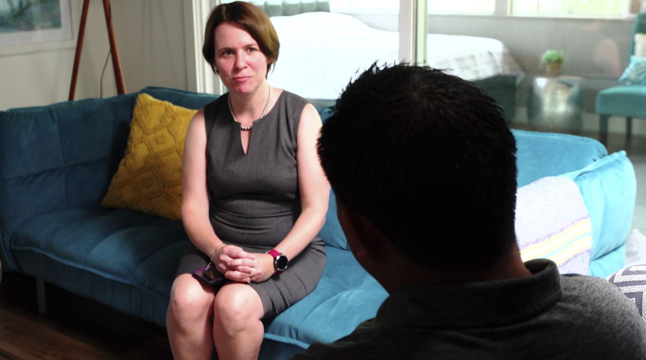 Attorney Michelle Lapointe speaks with her client, a Guatemalan immigrant, in Santa Ana, California.