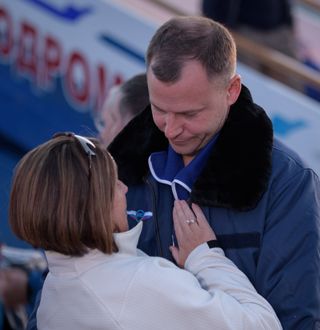 Astronaut Nick Hague and his wife, Catie Hague, greet each other after his tumultuous launch.