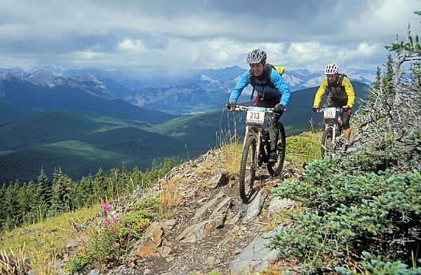 Two racers amidst the breathtaking scenery of the TransRockies stage race.