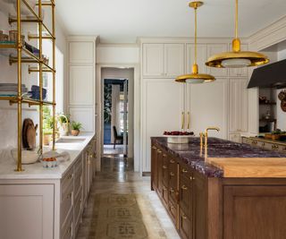 Pink and brown kitchen with gold accents