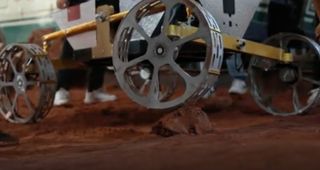 closeup of a robotic four-wheeled rover being tested here on earth