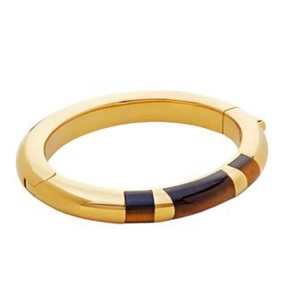 gold thick bangle with tortoiseshell striped design