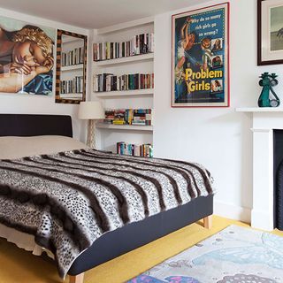 bedroom with white wall and wooden flooring