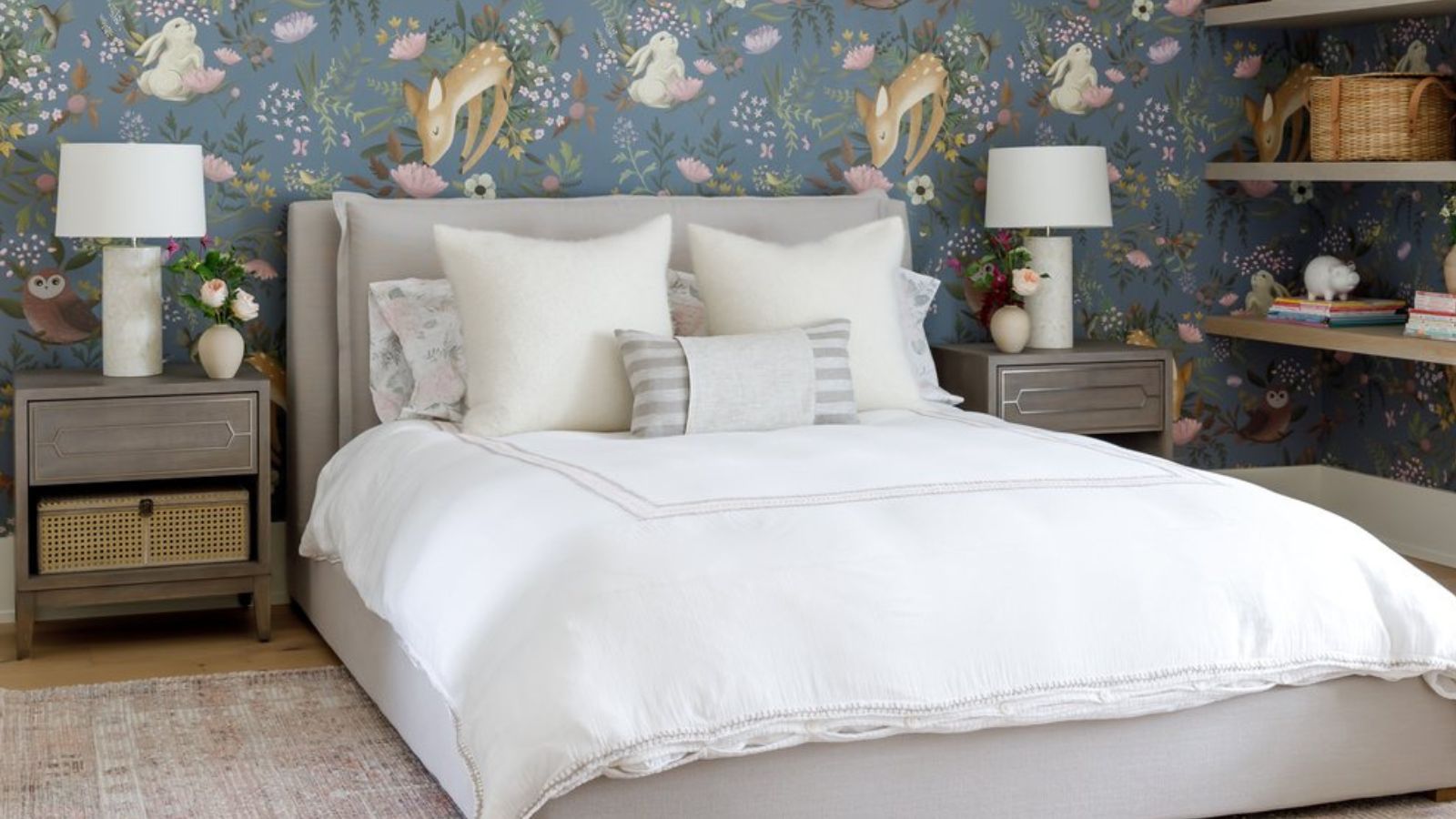 Children&#039;s bedroom with forest animal wallpaper