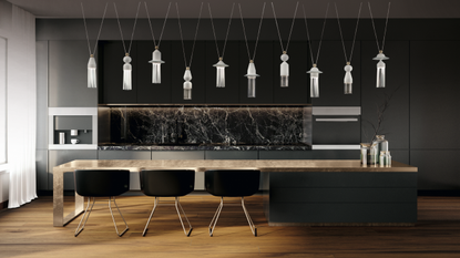 3 pendant lights hang from a kitchen ceiling 