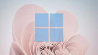 Windows 11 wallpaper with blue Windows 11 logo superimposed 