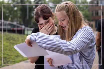 When is GCSE results day 2022 illustrated with two teenage girls looking at pieces of paper 