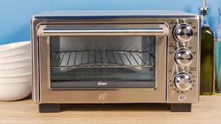 Oster Convection 4-Slice Toaster Oven being tested by writer