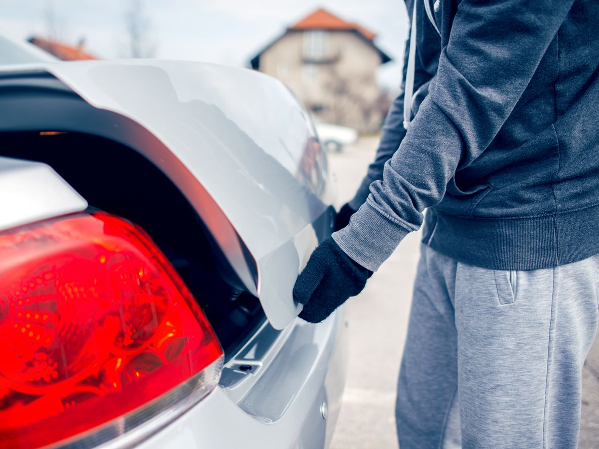 Man opening car trunk