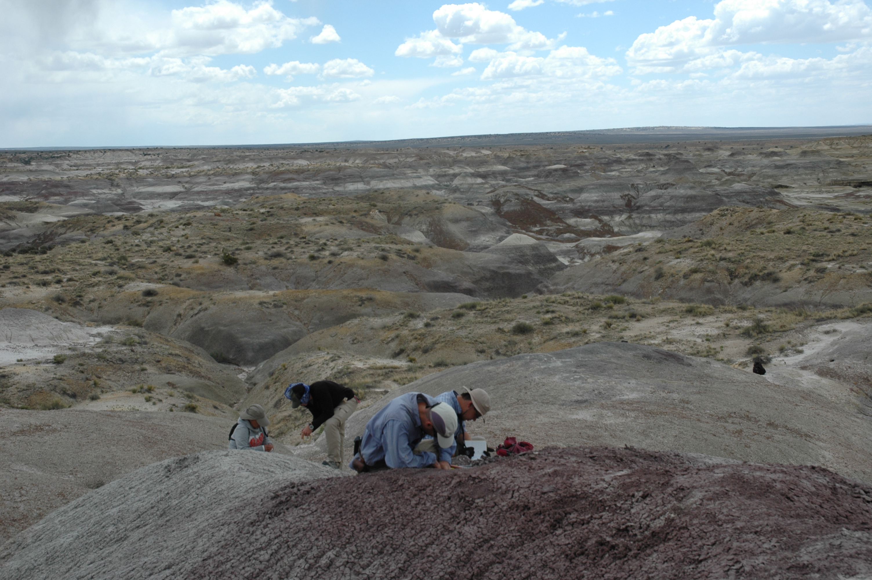 A photograph of researchers collecting paleomagnetic samples in the San Juan Basin of northwestern New Mexico.