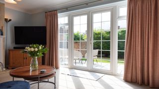 A home with curtains and French doors