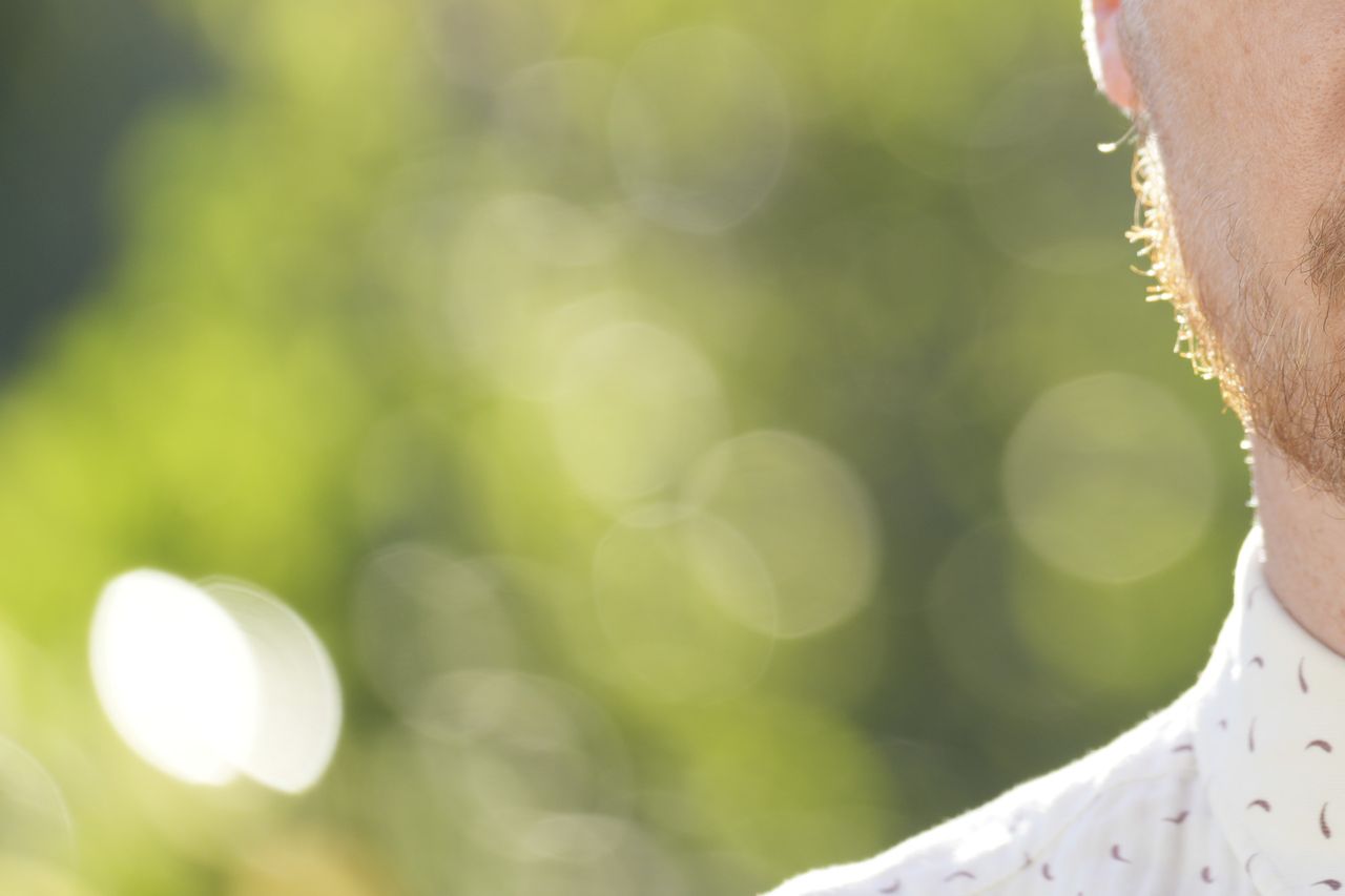 Close crop to show bokeh in outdoors telephoto portrait at the widest F4 aperture and 200mm focal length of the Sony FE 70-200mm F4 G OSS II lens