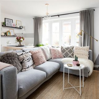 living room with sofa and white round table