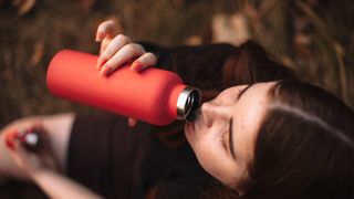 Woman drinking water from a water bottle