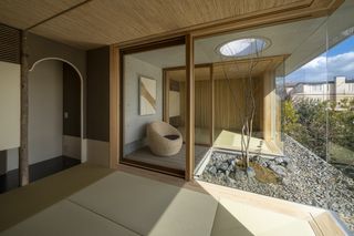 Interior and garden views at modern concrete japanese house by maniera architects